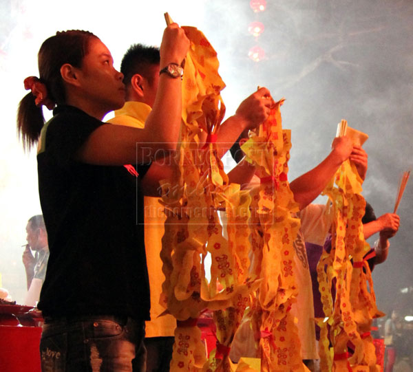 SEEKING BLESSINGS: Devotees make their offerings.