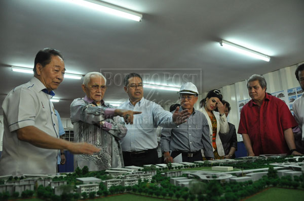 READY SOON: Taib (second left) being briefed on the work progress by Wong (left) and Abdul Hakim.