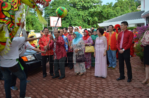 LET ME TRY: Salahuddin teases the ‘dragon’ with a dragon ball while others look on. 