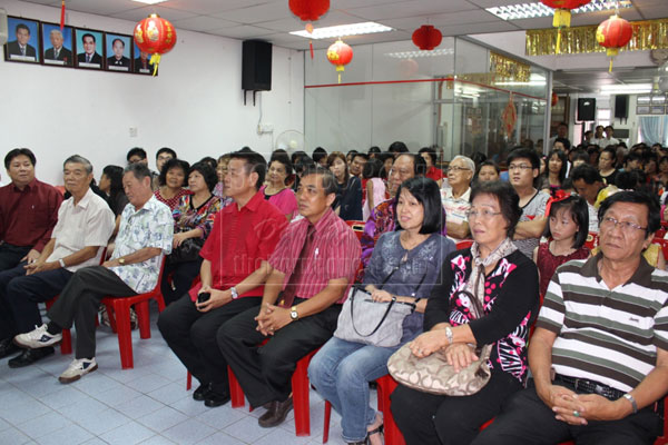 ATTENTIVE: Ding (fourth left) at the Lim Clan Association CNY gathering. 