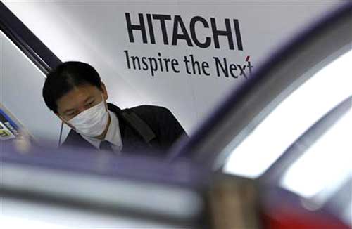 OPTIMISTIC OUTLOOK: File photo shows a Hitachi employee at work. The group is optimistic on Malaysia’s CME industry outlook given its increasing sophistication and large market size. — Reuters photo