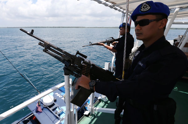 The marine police boat seen patrolling the waters off Kampung Tanduo.