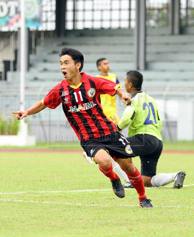 ON CLOUD NINE: Young Croc’s supersub striker, Eugene Thomas in jubilant mood after scoring his first goal against Perlis during the President’s Cup match played at di State Stadium, Petra Jaya yesterday. Sarawak won 2-0. — Photo by Chimon Upon