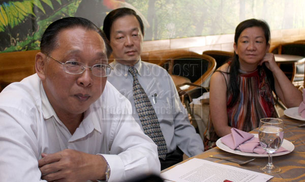Chan (left) speaking to reporters yesterday.