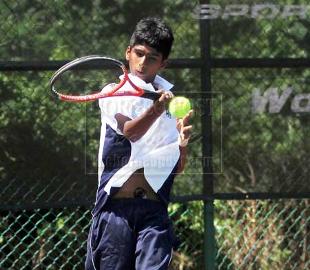 UPSET WIN: Pakistan’s Syed Nofil Kaleem readies to hit a backhand return to his opponent from Sri Lanka Andrew Muttiah during the second singles of the Boys U-14 Group C match at the Asia-Oceania Pre-Qualifying for World Junior Team Boys yesterday. Syed Nofil won 6-2, 6-1. — Photo by Davidson Kho