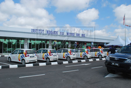 WELL EQUIPPED: The newly opened Institut Memandu NB Motors Sdn Bhd (IMNB) in Kota Samarahan with its brand new learner driver vehicles. 