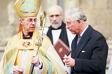 ANGLICAN SPIRITUAL LEADER: Welby speaks to Britain’s Prince Charles after his enthronement ceremony at Canterbury Cathedraly. — Reuters photo