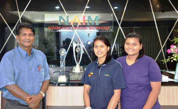 NEROSHA ON THE RISE: Seventeen-year-old Nerosha (centre) attributes her success to her supportive family and sponsorship by Naim. She poses with her father and sister here.