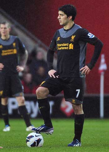 WILL HE STAY?: Liverpool’s Luis Suarez react after conceding a third goal to Southampton during their English Premier League match at St Mary’s Stadium in Southampton in southern England in this March 16 file photo. — Reuters photo