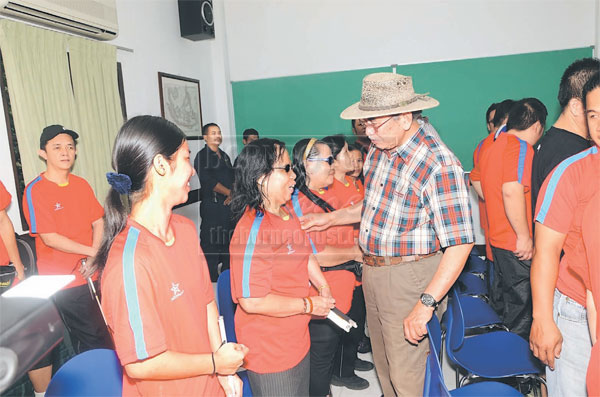 GIVING SUPPORT: Wan Junaidi having a light moment with members of the SBM.