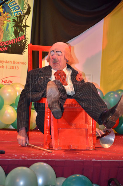 OOPS, WHAT HAPPENED: A clown    balanced himself as he sat on a ‘malfunctioning’ chair during an act that night.