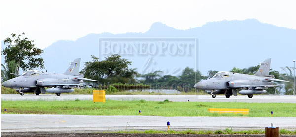 KUCHING: Hawk fighter jets are pictured at the runway of Kuching International Airport near the Royal Malaysian Air Force base. Several fighter jets were seen landing at and taking off from the runway yesterday. It is believed that they are part of the operation codenamed ‘Ops Daulat’ which was launched in response to the intrusion by armed intruders in Lahad Datu, Sabah. — Photo by Chimon Upon 