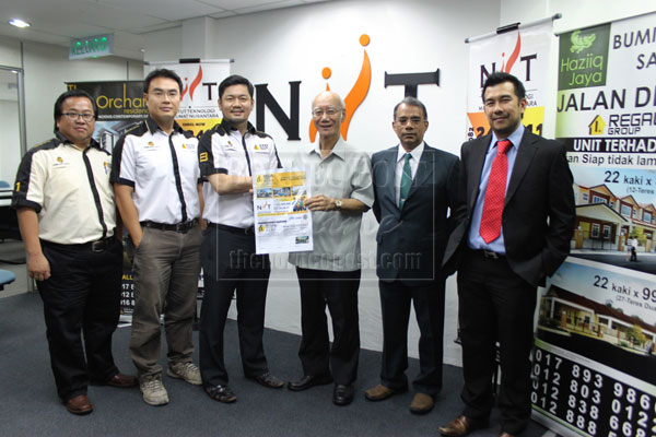 GOOD DEAL: Wong (third left) and Tiong (third right) displaying a sample voucher from Regal Group. Also seen are Regal Group marketing manager Georg Liang (left), Regal Group project director Frederick Eng (second left), NITT College head of IT Faculty Dr Prabha Ramakrishnan (second right) and Voon (right).