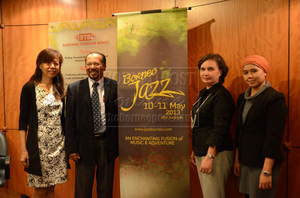 MUSIC ADVENTURE: Rashid (second left) with STB’s director of corporate communications Angela Bateman (second right), Yeah (left) and project event manager Qarmilla Chin Abdullah after the ribbon cutting ceremony to launch the Borneo Jazz Festival 2013. — Photo by Karen Bong (File Photo)