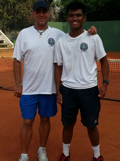HISTORIC ACHIEVMENT: Local tennis ace, Mohd Assri Merzuki (right) collected his first professional ranking point by winning the first round of the India F1 Futures. At left is his coach Doru Murariu.