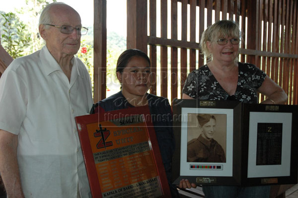 ONLY SURVIVOR: Jack Tredrea (left) and Judi (right) with a school staff in Bario.