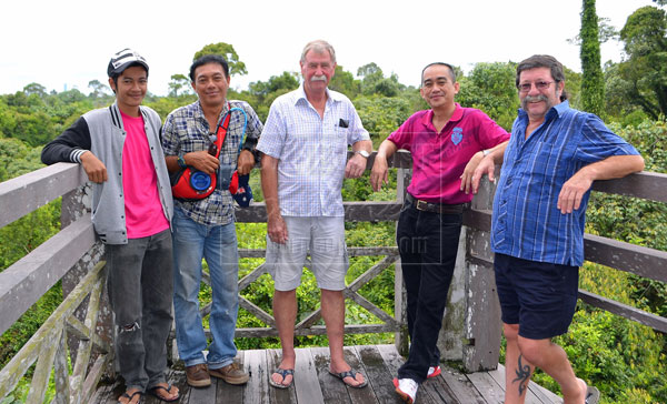 AT EASE: (From right) Dr Morely, Rudi, Bob, Melintan and a friend at the lookout tower.