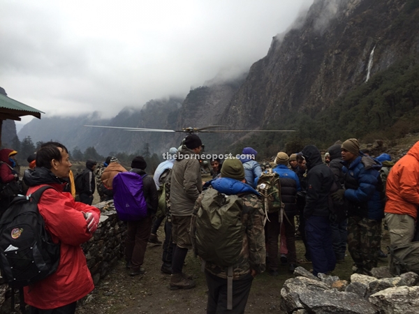 Climbers in Lantang National Park awaiting pickup after Nepal earthquake