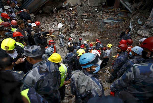 Members of the Nepalese Armed Police Force work at the ruins of the Hilton Hotel, the site where earthquake survivor Pema Lama, 15, was trapped in following an earthquake in Kathmandu, Nepal. — Reuters photo