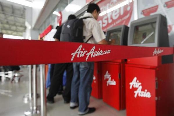 File photo shows passengers checking in an AirAsia flight at Soekarno-Hatta International Airport in Jakarta. — Reuters photo