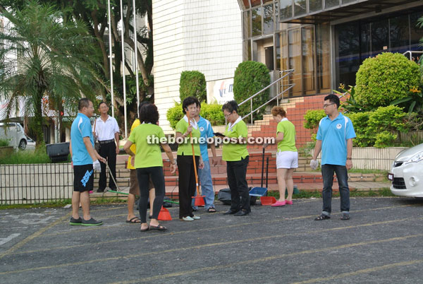 Some Chinese community leaders preparing to do some cleaning at Song Thian Cheok Road here.