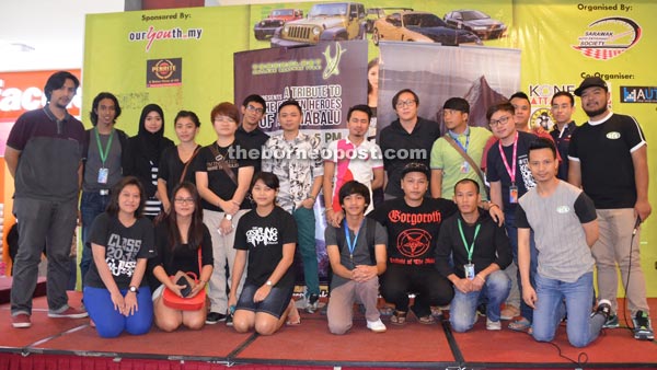 TCS chief operating officer Amin Aznizan (back row, left) and Augustine (front row, second right) in a group photo with performers and students from Technology College Sarawak during ‘A Tribute to The Fallen Heroes of Aki Nabalu’ mini concert held at CityONE Megamall on June 14.