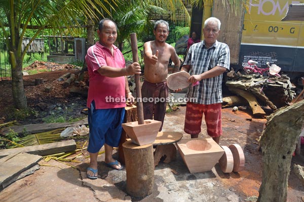 (From right) Rami, Latok and Mancha show their wooden products. 