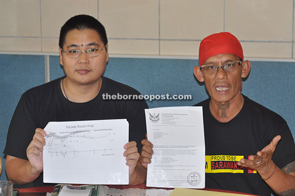 Peter (right) and parade coordinator William Bong speaking at the press conference yesterday.