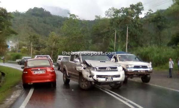 Some of the vehicles that were involved in the accident at Km 26 Ranau-Tamparuli Road yesterday.