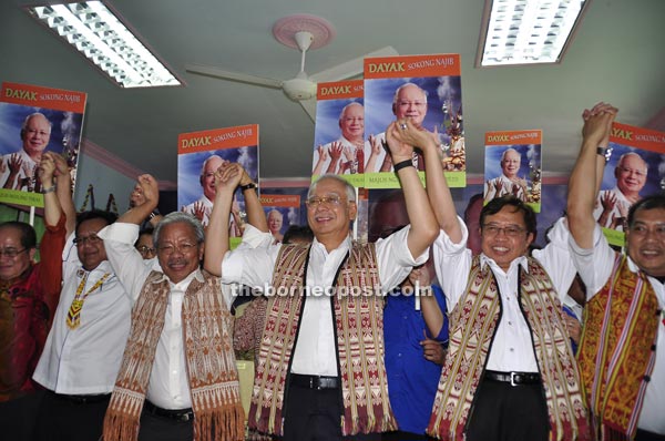 (From right) Ugak, Abang Johari, Najib, Masing, Nanta and Uggah joining hands in a show of the state leaders’ support for the prime minister.