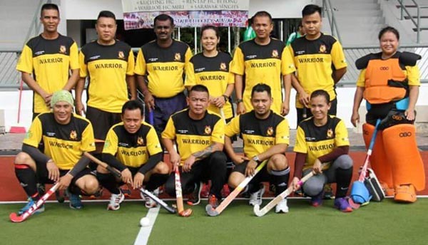 Rudy (standing third left) with Warrior Hockey Club members.