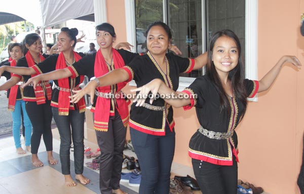 Teenage girls from Kampung Taee performing a traditional dance.