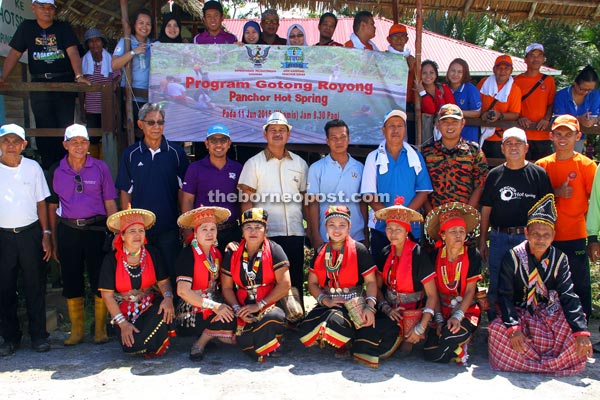 Ik Pahon (standing fifth left, front row) with other participants after the work party.  