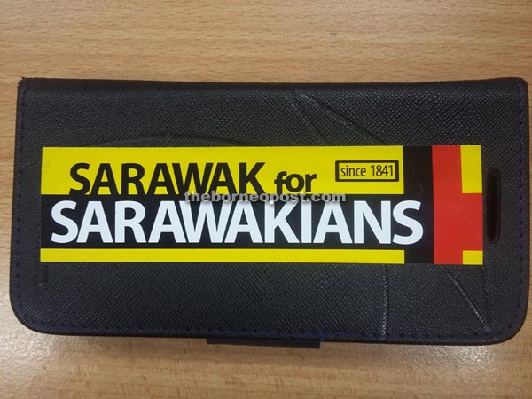 A ‘Sarawak for Sarawakians’ sticker pasted on a mobile phone casing. 