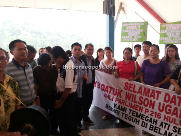 PRS women and supporters holding placards to welcome Ugak (centre) at Kapit Express Wharf Terminal.