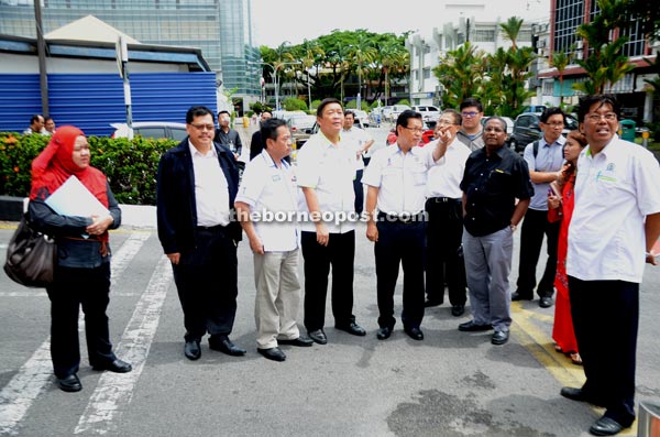 Dr Sundaran (front row, second right) and others being briefed by Lee (fourth left) on the proposed UTC for Miri.