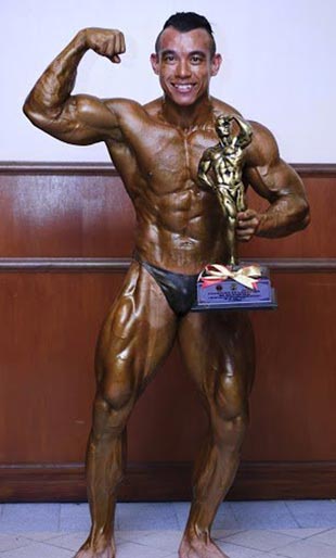 Azizul with his trophy won at the Mr Malaysia Bodybuilding Championships in Labuan.