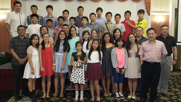 The swimmers posing with Lo (right, front row), Wee (left, second row), Karen (second left), Robert (left, back row) and the Sarawak Club committee members during the appreciation dinner on Thursday.