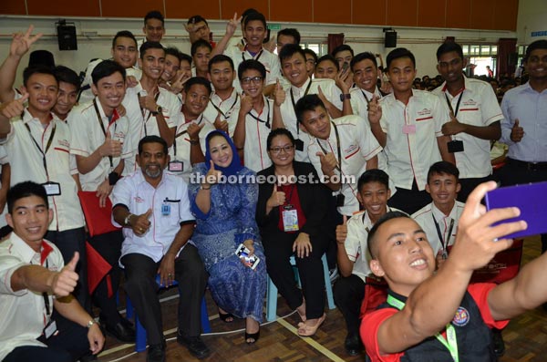 Sharifah (seated centre) and Sahul on her right with the June intake of PKS students at the closing of Familiarisation Week. — Photo by Jeffery Mostapa