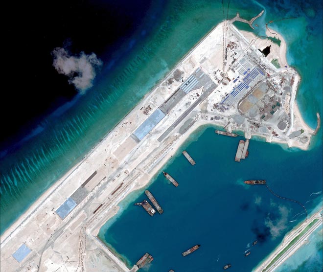 This file handout photo taken by satellite imagery provider DigitalGlobe and released to AFP by the Asia Maritime Transparency Initiative department at the Centre for Strategic and International Studies (CSSI) think tank shows a satellite image of what is claimed to be an under-construction airstrip at Fiery Cross Reef in the Spratly Islands in the disputed South China Sea. — AFP photo