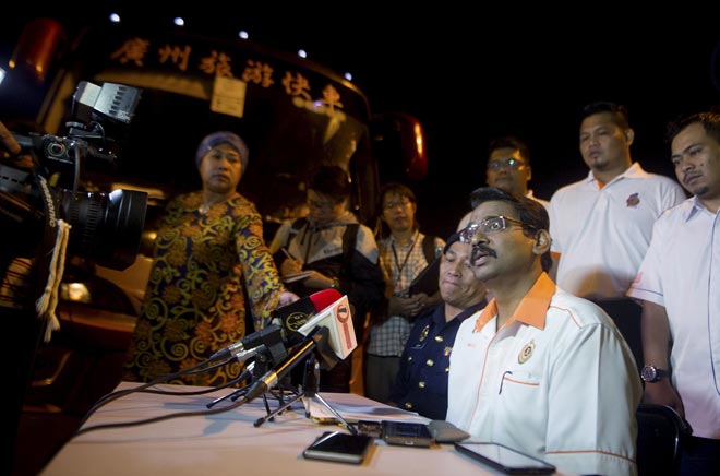 Valluvan (seated right) at a press conference during the operation codenamed ‘Ops Bas Ekspres’ at the Sungai Buloh rest and recreation (Kuala Lumpur-bound) area. — Bernama photo