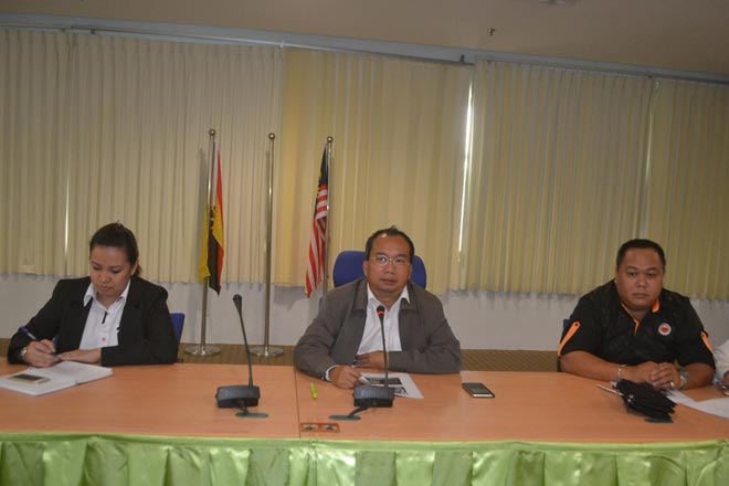 Elvis (centre) chairing the committee meeting, flanked by administrative officer Vanessa Joseph (left) and Jack Janda (right).