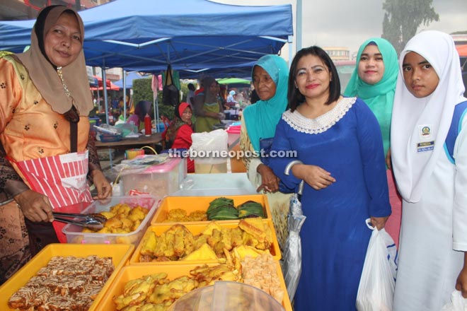 Nadia (left) with some of her customers.
