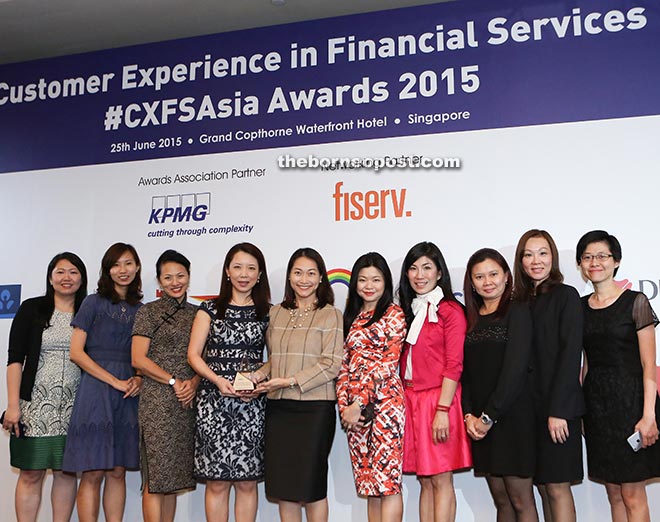 Receiving the `Best Customer Experience Business Model’ award in the Customer Experience in Financial Services (CXFS) Asia Awards 2015 on behalf of UOB Malaysia were (starting from third left) UOB Singapore head of group strategic communications and customer advocacy Nicolette Rappa, UOB Singapore head of group customer advocacy and service quality Janice Ang, UOB Malaysia head of customer advocacy and service quality and Michelle Liew and other members from the UOB team.