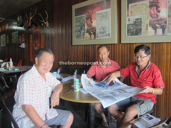 (From left) Wee, Chang and Ngu meeting the BAT V team at a coffee shop at Balingian Bazaar.