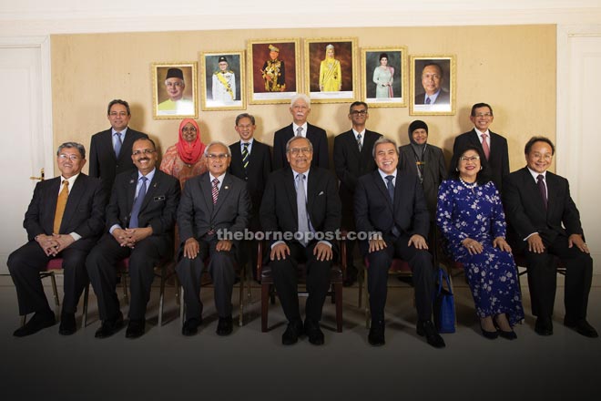 Adenan (seated, centre) with (from right) Baya, Rafidah, Awang Tengah, Jabu, Dr Ali and Morshidi with other board members of Recoda after the meeting earlier this week. 
