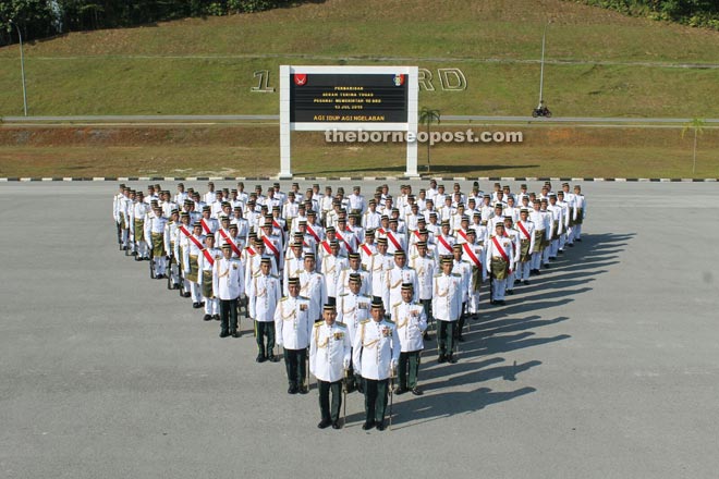 Officers and men of other ranks in a formation at the handover of duty parade.