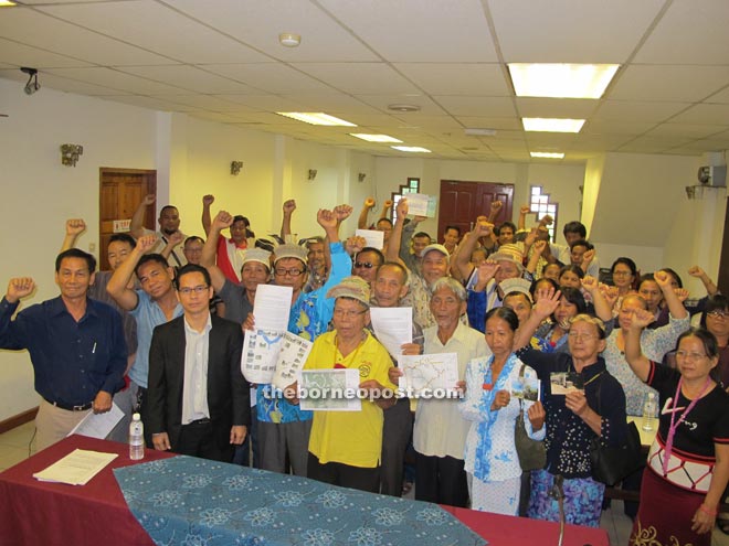 Jok (left), Abun (third left), Ajeng (fourth left) and the affected landowners from Long Pilah are urging the chief minister to solve illegal logging in their NCR land.  