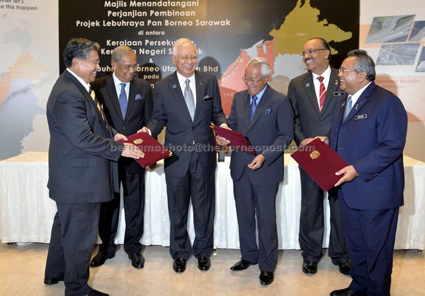 Najib (third left) having a light moment with (from left) Morshidi, Adenan,  Ahmad Urai, Dr Ali andn Zohari after the signing ceremony. — Bernama photo