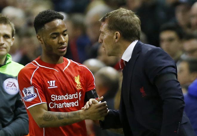 Liverpool’s Raheem Sterling shakes hands with manager Brendan Rodgers after their Premier League match against Newcastle, in this April 13 file photo. — Reuters photo